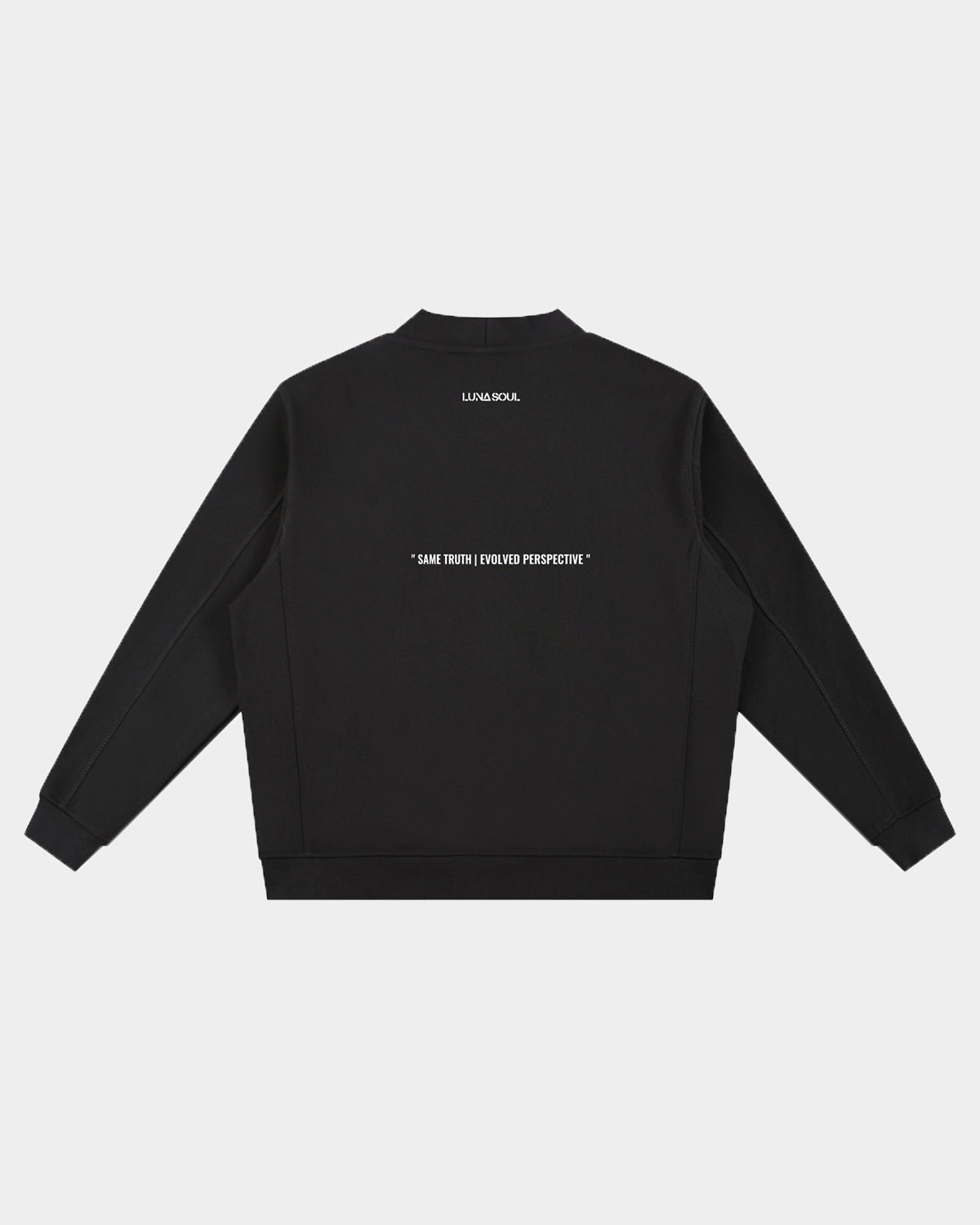 Back view of black unisex cardigan featuring white Same Truth Evolved Perspective quote print. Close up detail of heavyweight black 450gsm cotton fabric texture and premium matte buttons