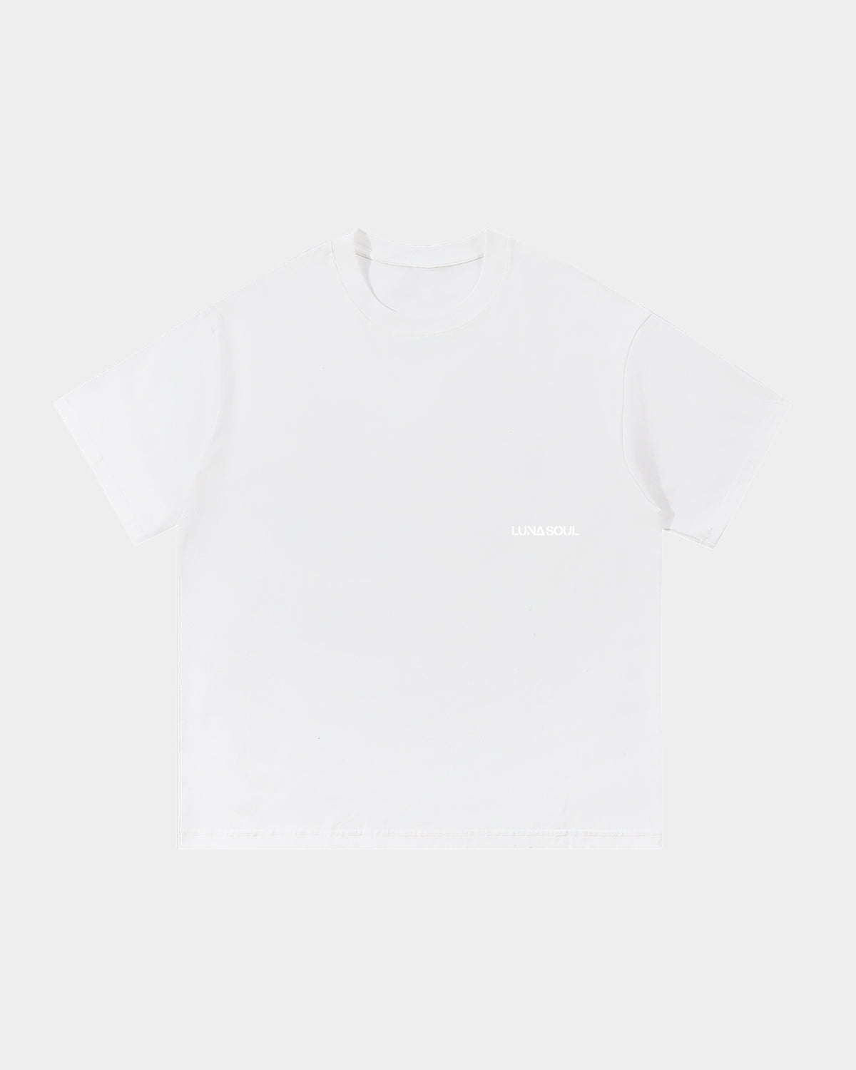 Luna Soul White Unisex Same Truth Tee, 260gsm heavyweight with a minimal front view, featuring a small white logo on the background, made from cotton fabric, and perfect for streetwear. Close-up detail of high crew neckline and premium cotton fabric.