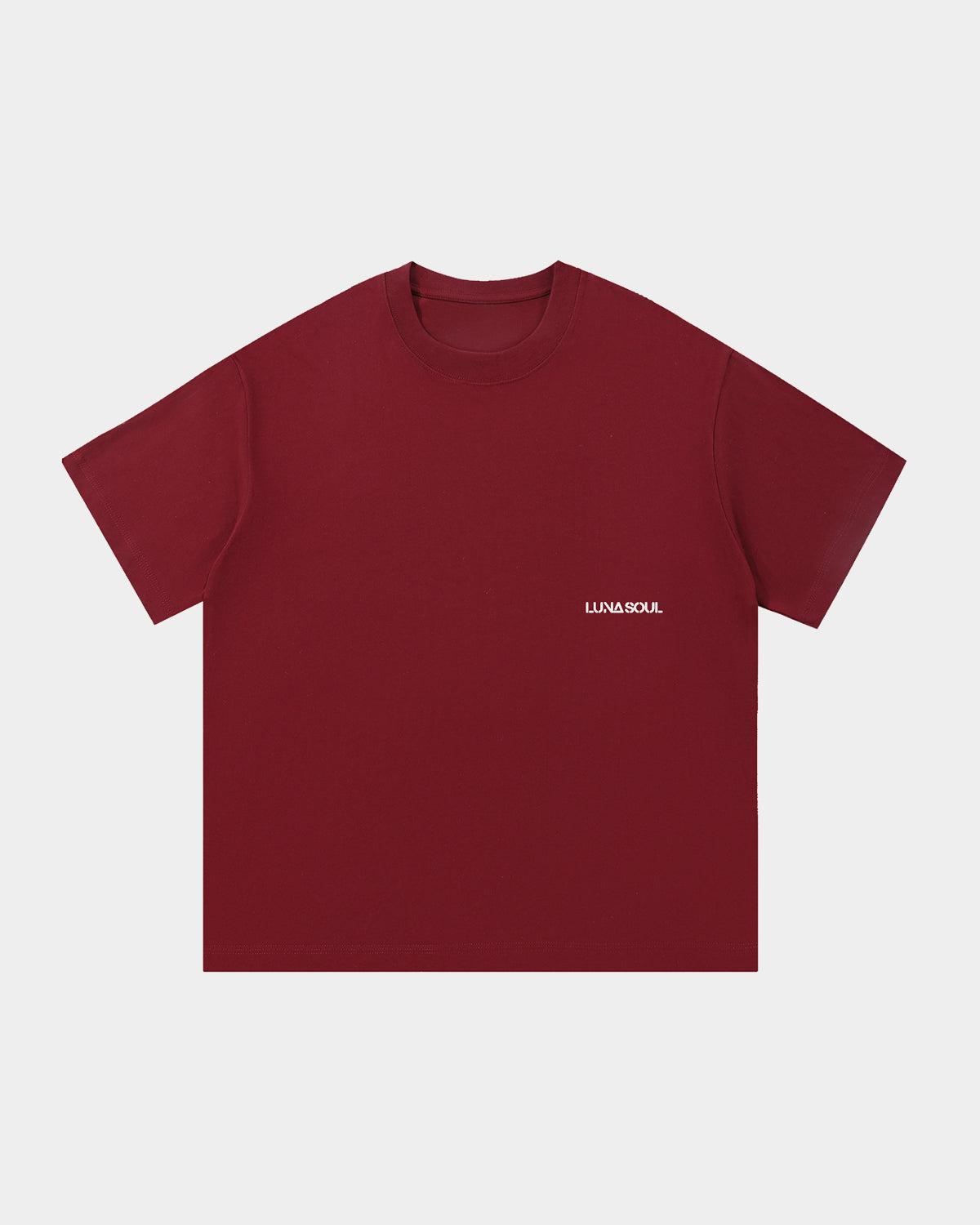Luna Soul Red Unisex Same Truth Tee, 260gsm heavyweight with a minimal front view, featuring a small white logo on the background, made from cotton fabric, and perfect for streetwear. Close-up detail of high crew neckline and premium cotton fabric.